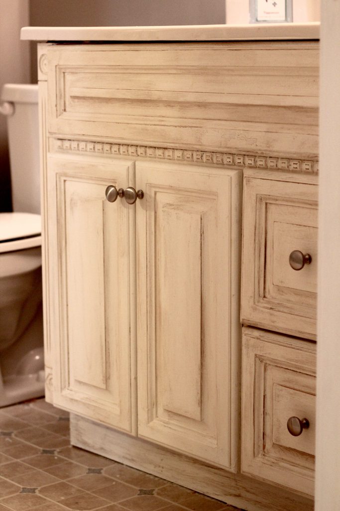 Another oak vanity bites the dust! Check out this beautiful, simple, and inexpensive makeover to this blogger's basement guest room bathroom vanity!