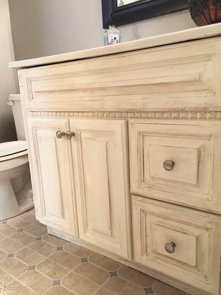 Another oak vanity bites the dust! Check out this beautiful, simple, and inexpensive makeover to this blogger's basement guest room bathroom vanity!