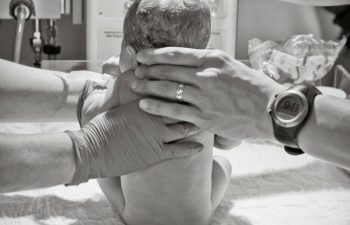 Birth Pictures: Four Reasons To Consider Hiring a Birth Photographer - #1The raw emotion of the two best moments of our lives is forever captured. The pictures of the moments immediately before and after we met our girls are so priceless to me. I'm so glad we have them.