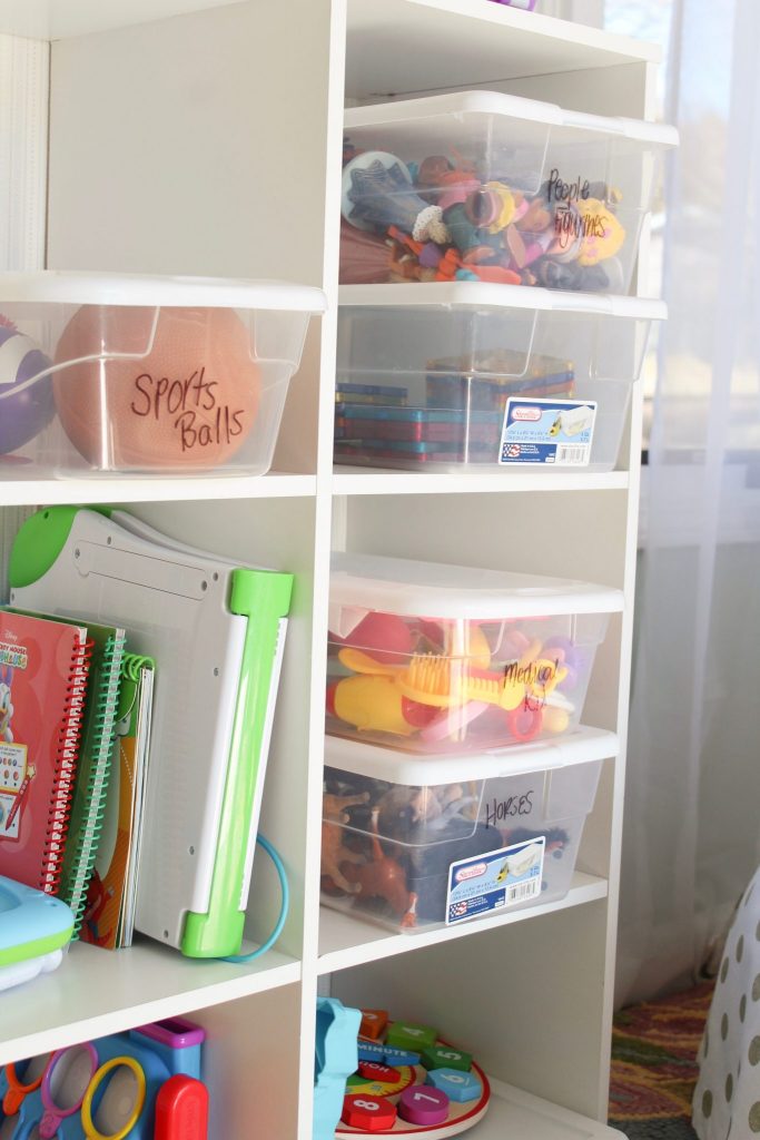 Inexpensive toy organization and a simplified playroom: Click here to read about the steps and very minimal things needed to declutter and organize the toys in your house once and for all. Whether you have a playroom or not, these tips for quick organization will not only help you feel like you have some control over the clutter, but your kids will also play better with what they have (hint: it's because they'll have less!). Click here to read more. | Whimsical September