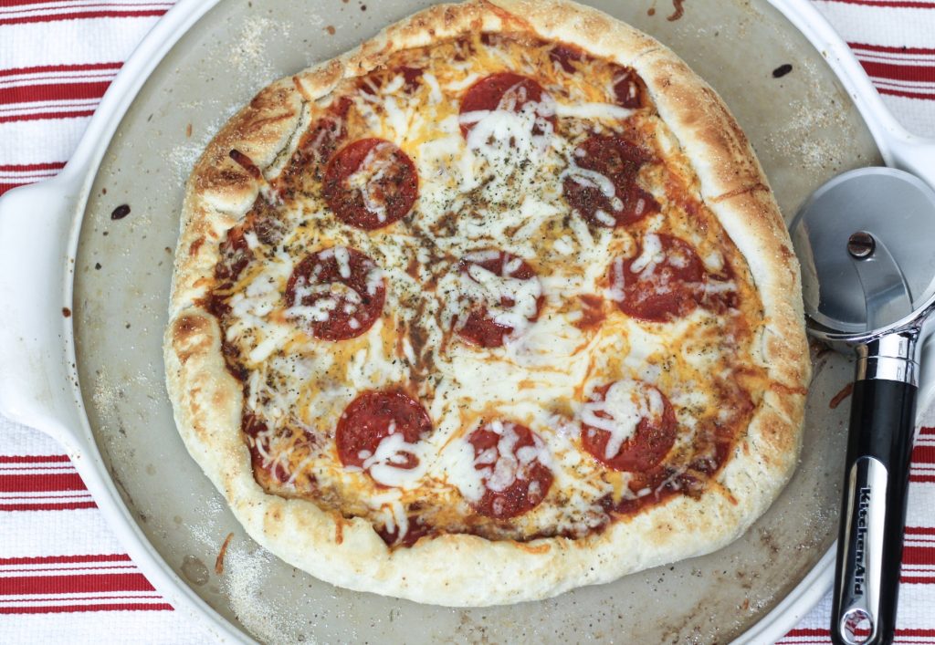 This easy homemade pizza dough recipe can be made a couple hours or a couple weeks before mealtime. It's simple, fast, freezable, and most importantly a recipe your whole family will love. This recipe has been revised and perfected for years, and now it's a crowd-pleaser that has everyone asking for seconds (or thirds). The dough is slightly sweet while providing a nice base for an endless variety of toppings. Enjoy!
